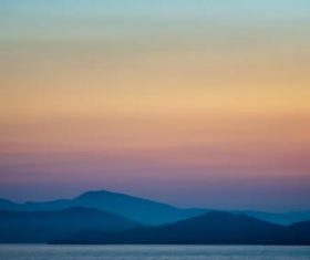 Sunset scenery of the distant mountains and the horizon Stock Photo