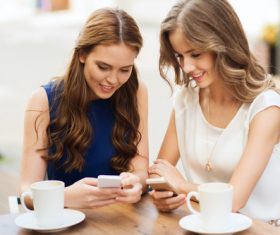 Two women keep each others phone number Stock Photo