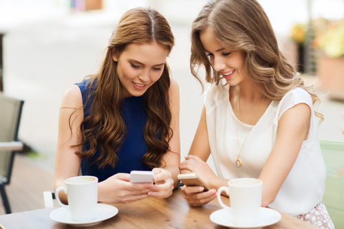 Two women keep each others phone number Stock Photo