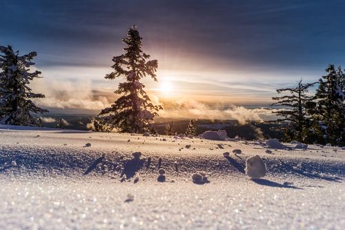 Winter snow with warm sunshine and natural scenery Stock Photo