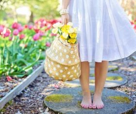 Woman holding a woven basket Stock Photo 03