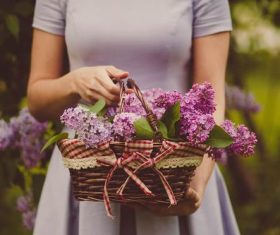 Woman holding a woven basket Stock Photo 04
