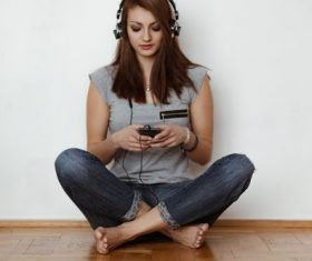 Woman listening to music Stock Photo 01