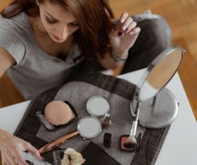 Woman preparing makeup Stock Photo
