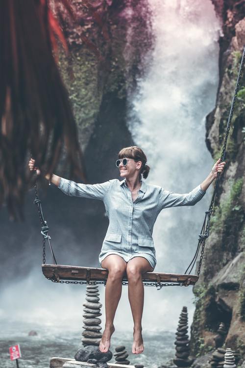 Woman swinging in scenic tourist area Stock Photo 02