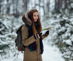 Woman traveling in winter field Stock Photo