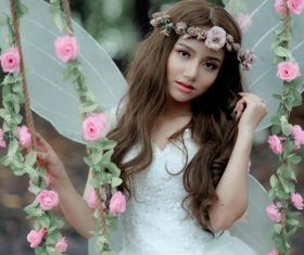 Woman wearing white gauze dress wearing wreath Stock Photo