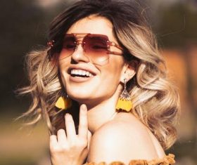 Woman with tinted sunglasses Stock Photo