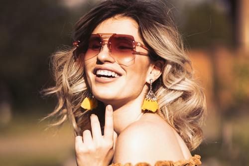 Woman with tinted sunglasses Stock Photo