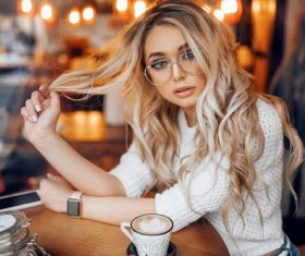 blonde women with glasses cellphone watch Stock Photo