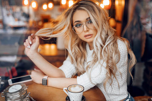 blonde women with glasses cellphone watch Stock Photo