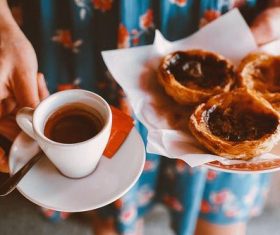 Afternoon tea coffee and custard tart Stock Photo