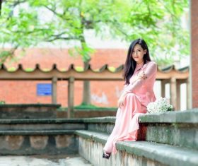 Asian woman wearing cheongsam with open toed shoes Stock Photo