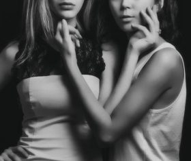 Black and white photo of two touching face women Stock Photo