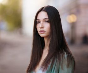 Black long hair girl with blurred background Stock Photo