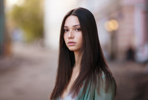 Black long hair girl with blurred background Stock Photo