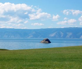 Blue lake with raised rocks Stock Photo