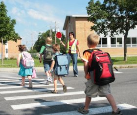 Children crossing the road Stock Photo