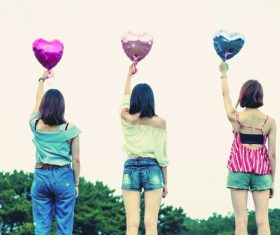 Girl holding balloon back shadow Stock Photo