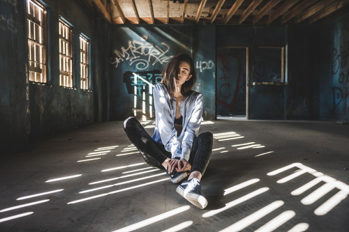 Girl posing in abandoned house Stock Photo