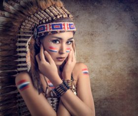 Girl soldier an Indian dress on head from feathers Stock Photo 07