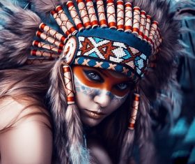 Girl soldier an Indian dress on head from feathers Stock Photo 08