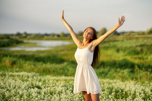 Girl stretching in the wild enjoying nature Stock Photo