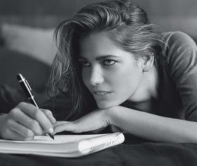 Girl writing notes Stock Photo