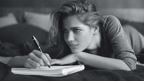 Girl writing notes Stock Photo