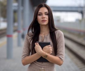 Hipster woman standing at the station Stock Photo