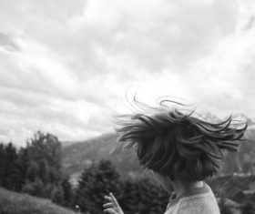 Little boy swinging hair Stock Photo