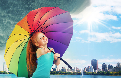 Little girl hold up an umbrella Stock Photo