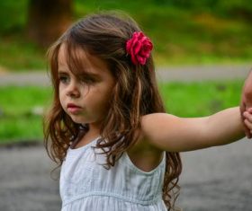 Little girl holding daddy hand Stock Photo