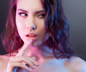 Pink hair gray eyes beautiful girl finger on lips Stock Photo 02