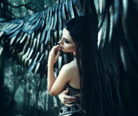 Pretty girl-demon with black wings Stock Photo 05