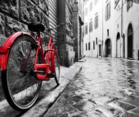Red bicycle parked on the street Stock Photo