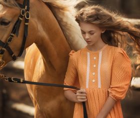 The girl led the horse Stock Photo
