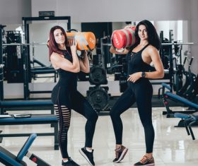 Two sporty women in the gym Stock Photo