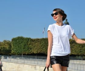 Wearing black leather shorts women with glasses Stock Photo