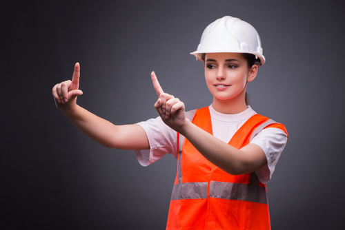 Wearing hard hat wearing overalls woman gesturing Stock Photo 03