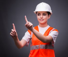 Wearing hard hat wearing overalls woman gesturing Stock Photo 04