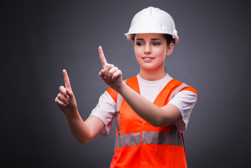 Wearing hard hat wearing overalls woman gesturing Stock Photo 04