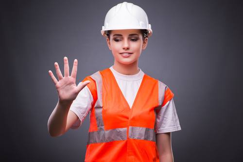 Wearing hard hat wearing overalls woman gesturing Stock Photo 05