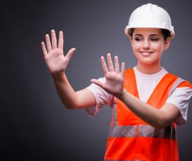 Wearing hard hat wearing overalls woman gesturing Stock Photo 06
