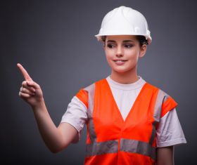 Wearing hard hat wearing overalls woman gesturing Stock Photo 07