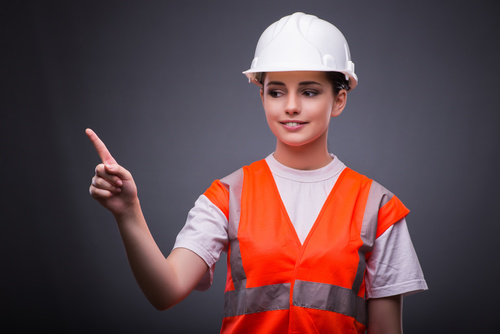Wearing hard hat wearing overalls woman gesturing Stock Photo 07