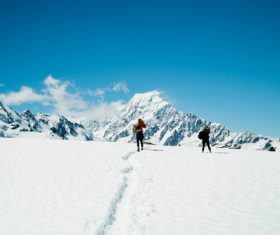 Winter mountaineering couple Stock Photo