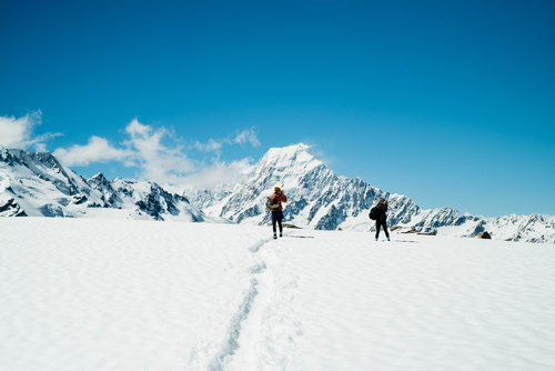 Winter mountaineering couple Stock Photo