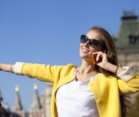 Woman answering the phone on the street Stock Photo 01
