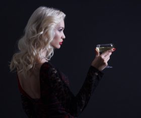 Woman holding a glass of champagne Stock Photo 02